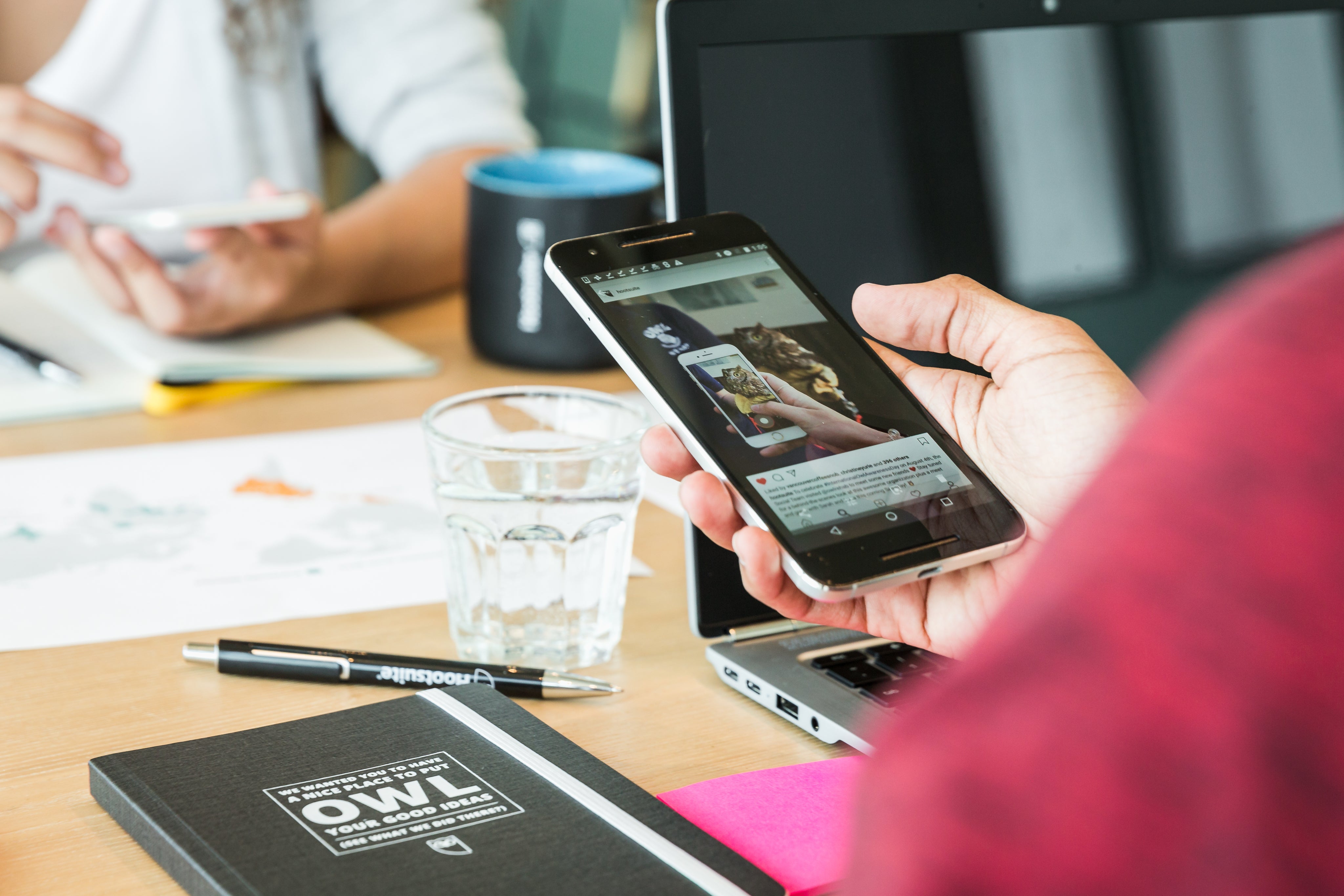 holding-a-smartphone-at-work.jpg
