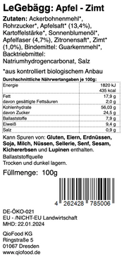 Das Bild zeigt ein Produktetikett von LeGebägg – Apfel Zimt 100 g mit einer Auflistung der Zutaten wie „Ackerbohnenmehl“, „Apfelsaft“ und „Zimt“ auf einer Hülsenfrucht von Qio Food.